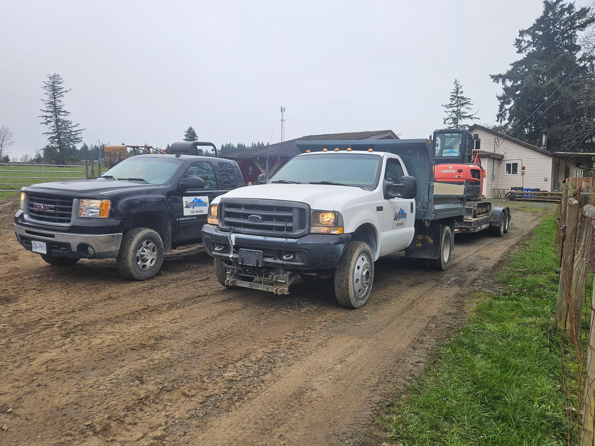 Couple of work trucks and excavator